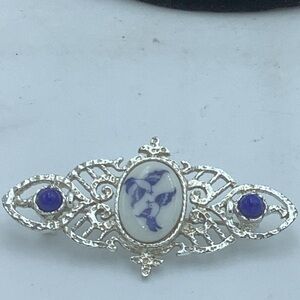 Silver-Tone Filigree Brooch with Blue/White Bird Design